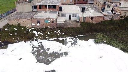Polluted river foam floats into Colombia town