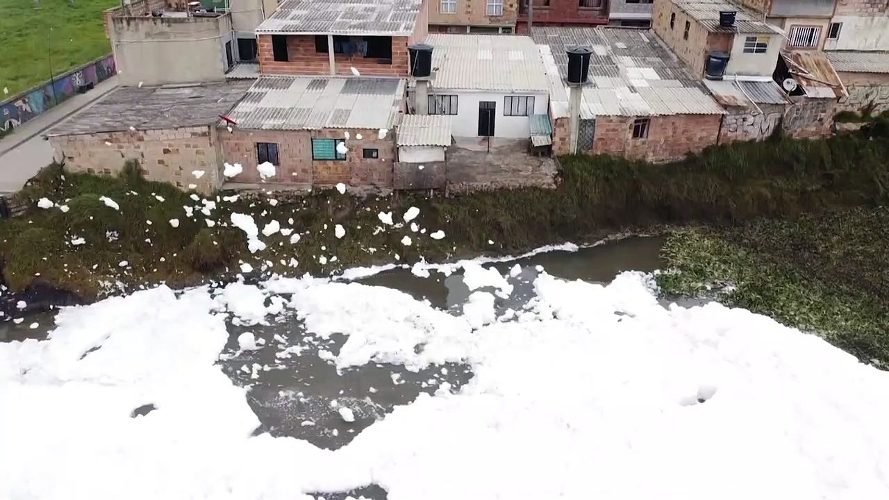 Polluted river foam floats into Colombia town