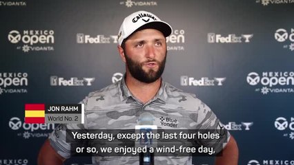 Rahm pleased after fighting wind to remain top