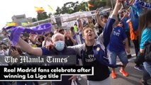 Real Madrid fans celebrate after winning La Liga title
