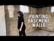 Woman Paints Walls While Doing DIY Basement Makeover