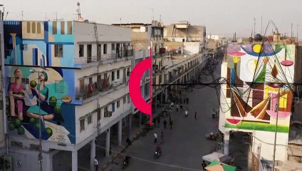 نقاشی بر دیوارهای بغداد با قلم‌موی هنرمند عراقی