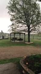 High Winds Send Anchored Down Trampoline Over Fence