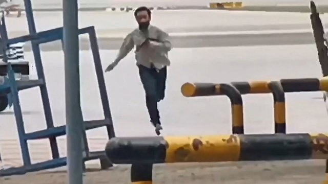 Axe-wielding gunman in Thailand swings at airport staff in a restricted area