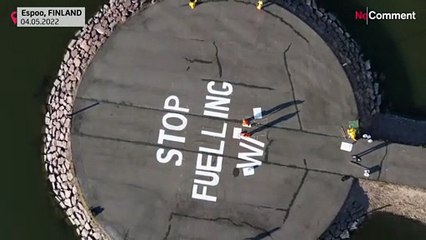 Finland: Greenpeace activists hang anti-war banner on power firm Fortum`'s HQ