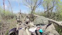 The servicemen of the Russian Armed Forces are gathering the killed Ukrainian soldiers