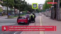 Ceza yazılıp ehliyetine el konulan sürücü ile polis arasında gerginlik