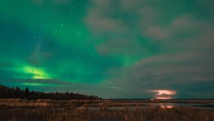 Northern lights and lightning combine for vivid light show over Canada