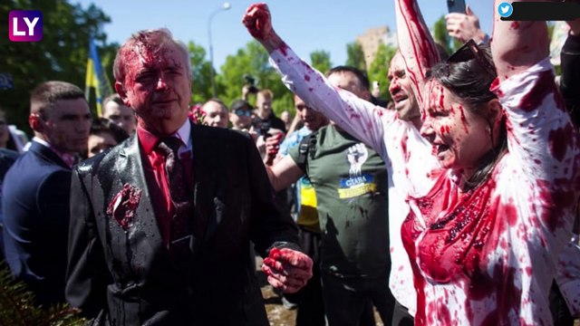 Russian Ambassador To Poland Doused In Red Paint By Anti-War Protesters