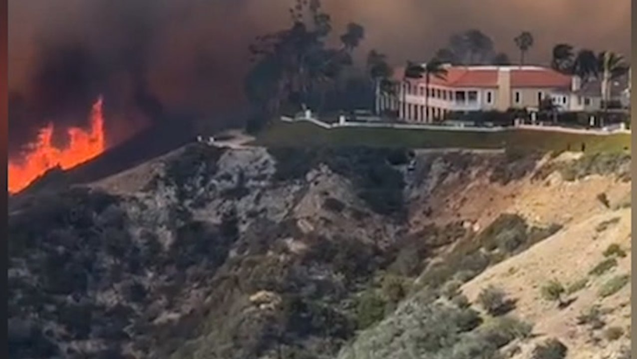 Watch as rapidly moving brushfire engulfs homes...