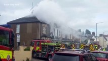 Firefighters tackling a roof fire in Pelham Road, Gravesend