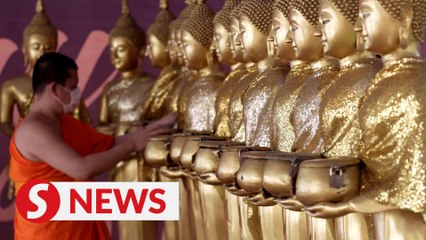 Devotees return to Buddhist temples for Wesak Day celebration