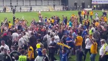 Boston United players and fans celebrate play-off win at AFC Fylde
