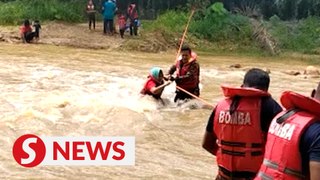 Firefighters rescue 13 stranded by Lubuk Ujik water surge