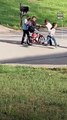 Neighborhood Kids Teach Young Boy to Ride Bike