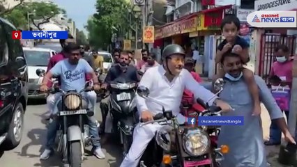 Download Video: Madan Mitra has seen riding a bike for Mamata Banerjee for Election campaign