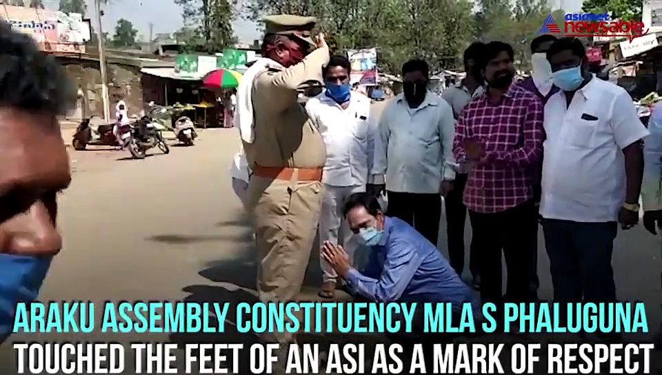 MLA touches feet of policeman as mark of respect