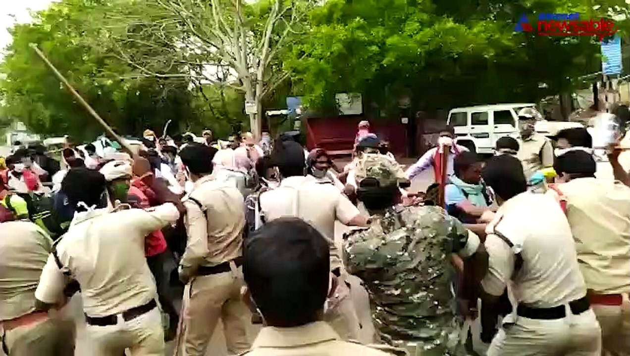 Migrant workers pelt stones at police