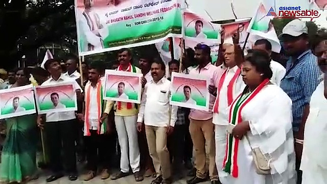 Congress supporters protesting outside their party headquarters in Bengaluru