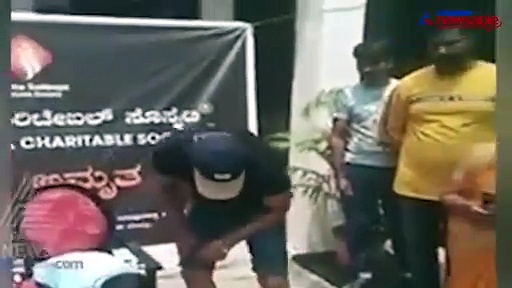 Kichcha Sudeep Charitable Society distributes shoes for government school students