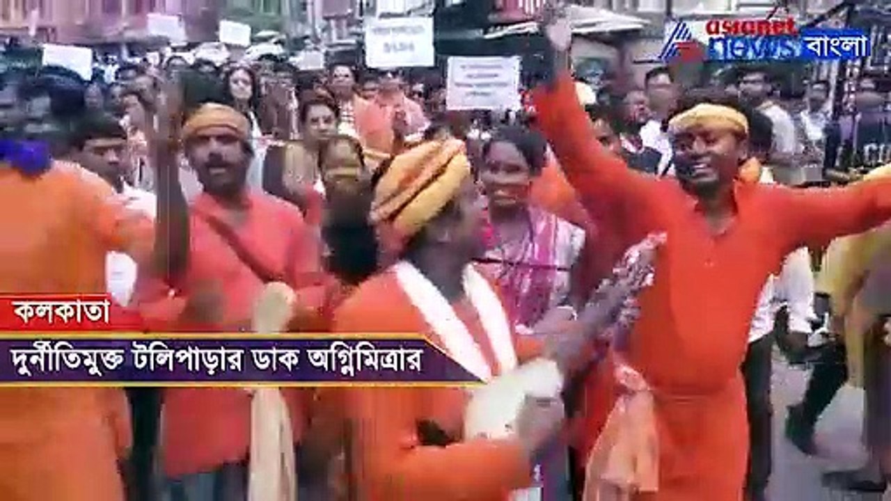 Agnimitra Paul walks in a rally with technicians