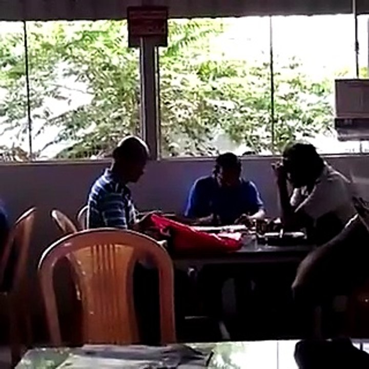 Is it wrong for a Tahsildar in Karnataka to be found in a coffee shop working on a Sunday?