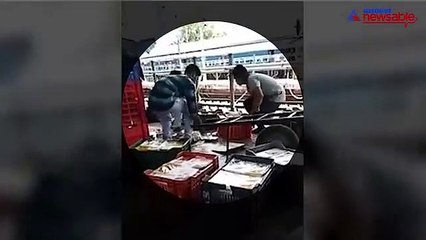 Railway staff in Vizag put spilt food back into boxes to serve