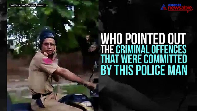 Cop slaps man who filmed him talking on the phone while riding