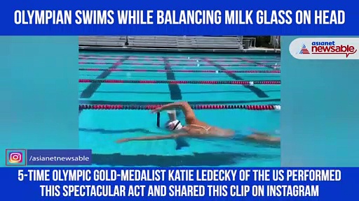 Olympic champion swims with glass of milk on head