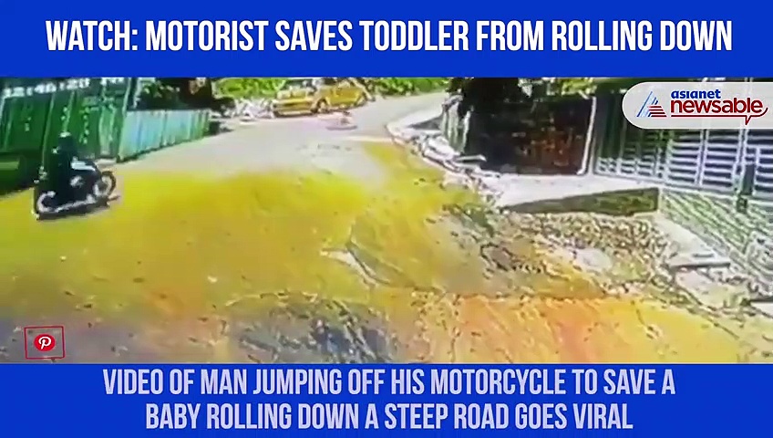 Man jumps off motorcycle, saves toddler rolling down a steep road; video goes viral