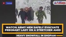 WATCH: Army men safely evacuate pregnant lady on a stretcher amid heavy snowfall in Shopian