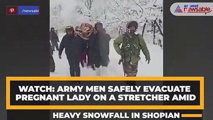 WATCH: Army men safely evacuate pregnant lady on a stretcher amid heavy snowfall in Shopian