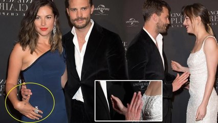 jamie Dornan keeps his distance from Dakota Johnson when he and his wife run into her at the event