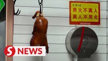 Beijing locals keep dining on duck despite Covid-19 concerns