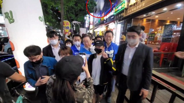 거리 유세하는 이재명 향해 철제그릇 던진 60대 체포 / YTN