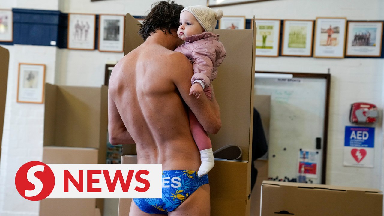 Australians show up in local style to vote in closely-fought election
