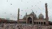 Pigeons fly in Jama masjid's courtyard inside on the eve of Eid