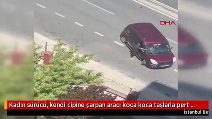 Kadın sürücü kendi cipine çarpan aracı taşlayarak pert etti!