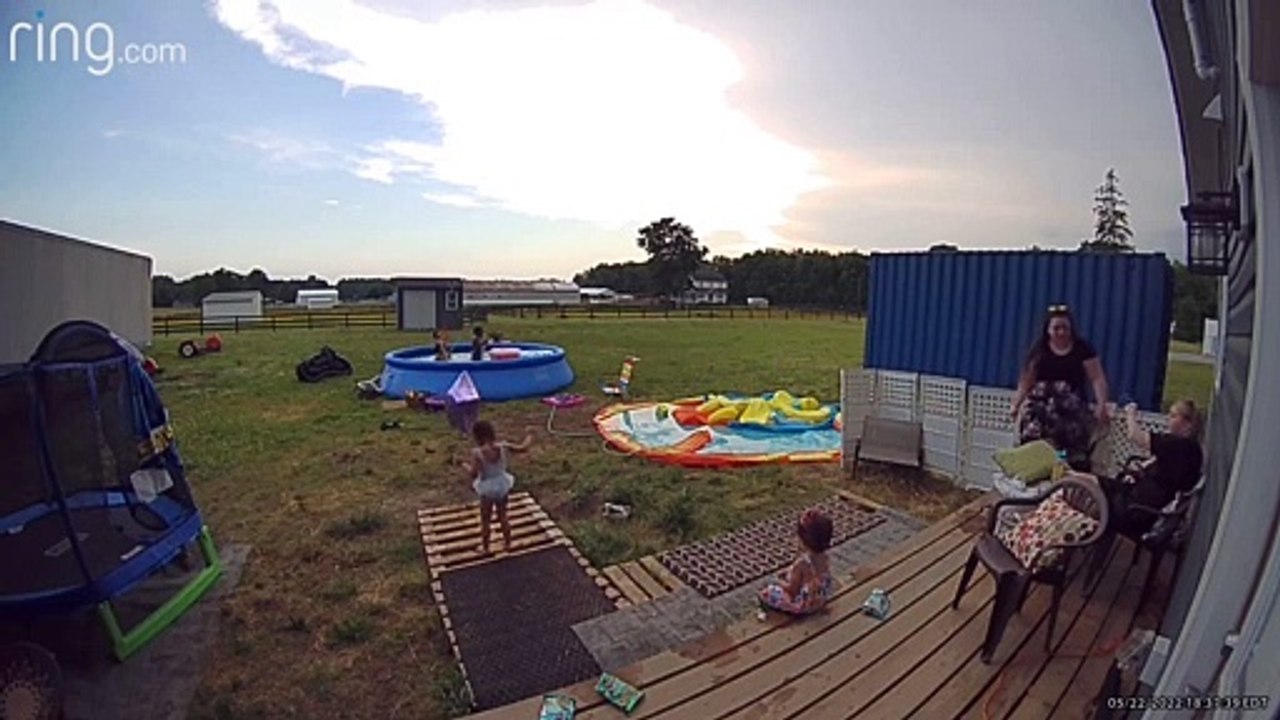 Plastic Chair Collapses and Woman Falls Backwards into Fence