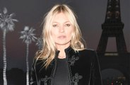 Kate Moss has denied a rumour that her ex Johnny Depp once pushed her down the stairs