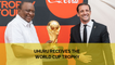 Uhuru receives the World Cup trophy