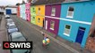 Quirky landlady unveils latest project - 25 houses all painted in different colours