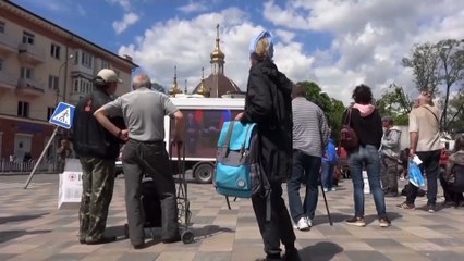 Russian propaganda trucks screen state news in war-torn city of Mariupol