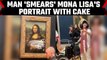 Mona Lisa attacked: Man disguised as elderly woman smears the painting with cake | OneIndia News