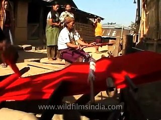 Lotha women weaving on back strap looms, Longsa village, Nagaland