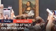 Mona Lisa smeared in cream in climate protest stunt