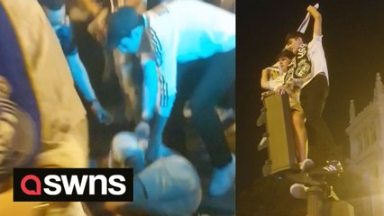 FALL FROM GRACE - Real Madrid fans danced on the top of a set of traffic lights - which smashed to the ground following the Champion's League Final