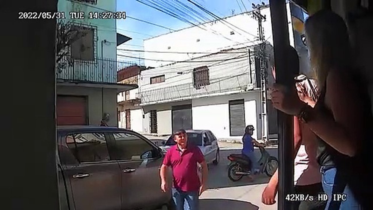 Boy Riding Bike Collides with Motorcycle and is Nearly Ran Over by Car