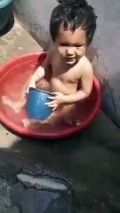 This baby loves playing in water so much