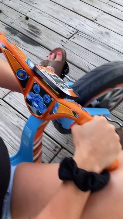 Woman Wipes Out on Toy Bike